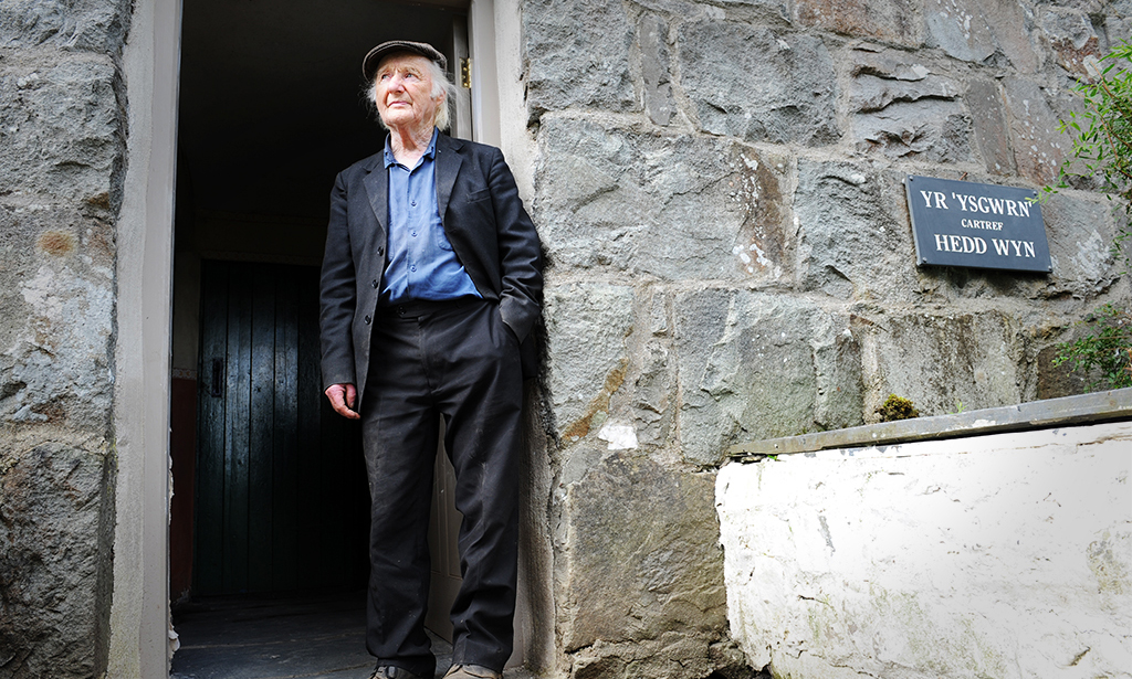 Gerald Williams standing at the doorway of Yr Ysgwrn's farmhouse